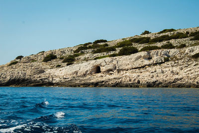 Scenic view of sea against clear blue sky