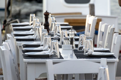 Empty chairs and tables in restaurant