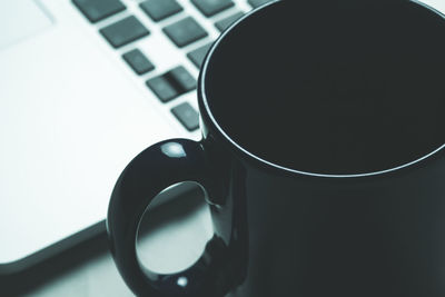 Close-up of coffee cup on table