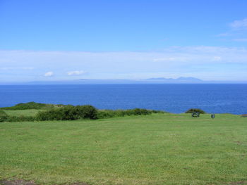 Scenic view of calm sea against cloudy sky