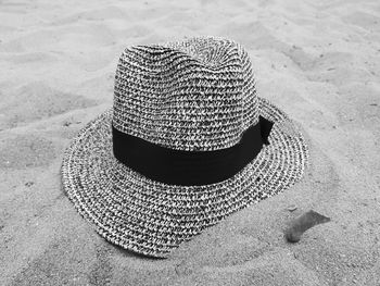 High angle view of hat on sand