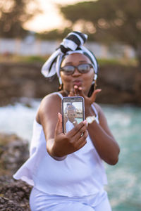 Young woman using mobile phone