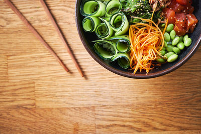 High angle view of chopped vegetables in bowl on table