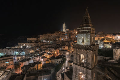 High angle view of illuminated buildings in city at night