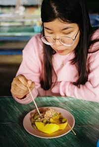 Portrait of woman having food