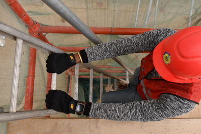 Low section of man working with umbrella