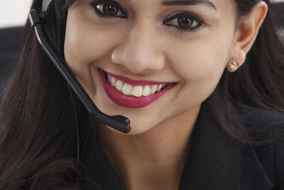 Close-up portrait of a smiling young woman