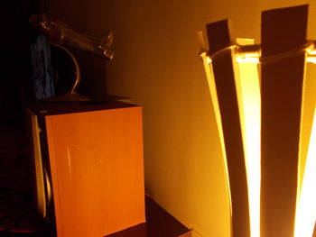 Illuminated lamp post at night
