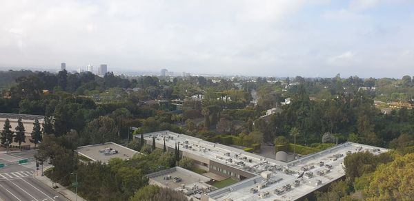 High angle view of buildings in city against sky