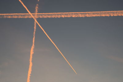 Low angle view of vapor trail against sky