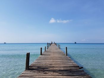 Pier over sea against sky