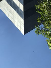 Low angle view of building against clear blue sky