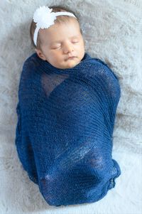 High angle view of baby sleeping