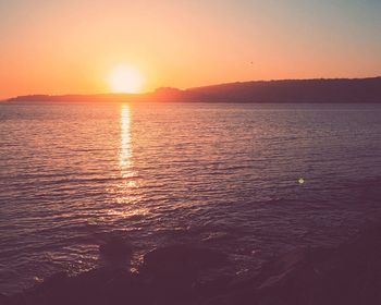 Scenic view of sunset over river