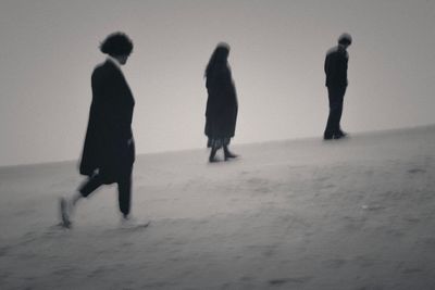 People walking on beach