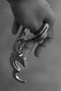 Close-up of hand holding cigarette