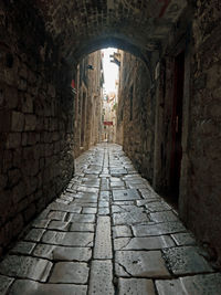 View of narrow alley amidst buildings