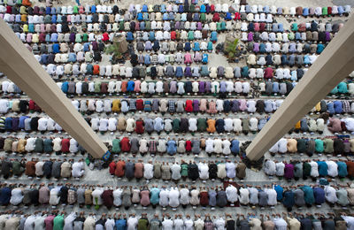 Large group of muslim people praying