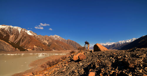 Scenic view of mountains against clear blue sky