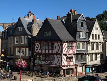 Buildings in town against clear sky