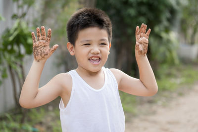 Portrait of happy boy in park