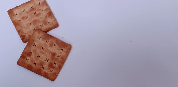 High angle view of bread against white background