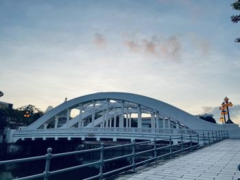 View of bridge against cloudy sky