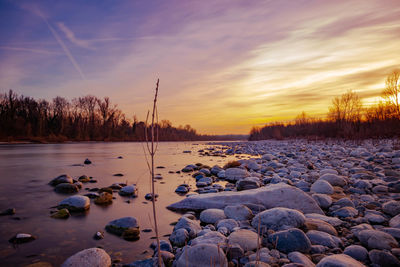 Scenic view of lake against sky during sunset