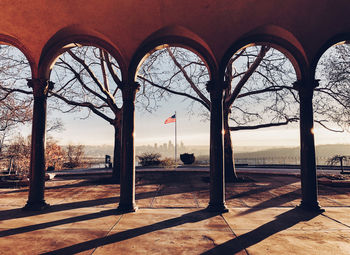 View of american flag seen through built structure