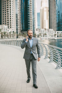 Full length of man standing in city