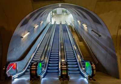 Low angle view of illuminated escalator