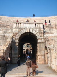 People in the courtyard of a building