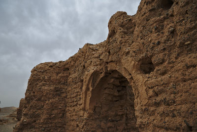 Low angle view of stone wall