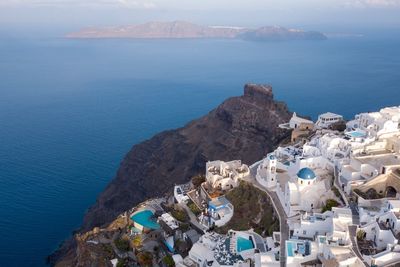 High angle view of sea and mountains against sky