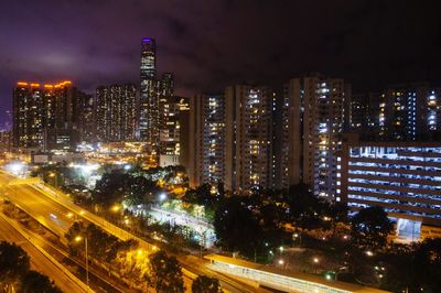 Illuminated modern buildings in city at night