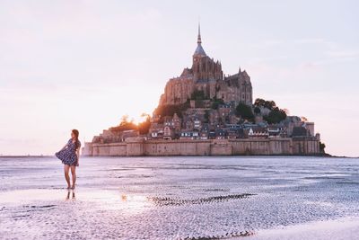 Woman standing in front of sea