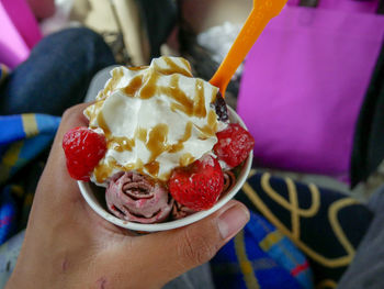 Midsection of person holding ice cream