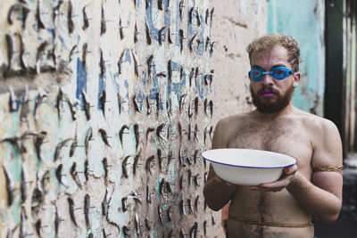 Man performs protest performance at the sao joaquim fair in salvador. 