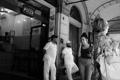 Group of people walking in corridor