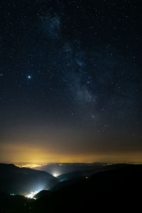 Scenic view of star field against sky at night