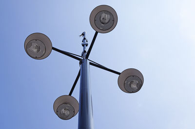 Low angle view of street light against sky