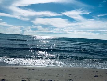 Scenic view of beach against sky
