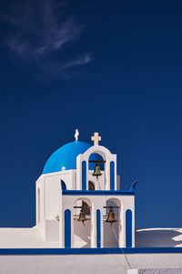 Low angle view of church against blue sky