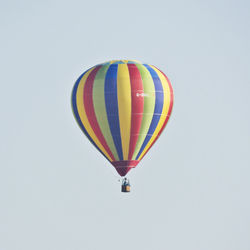 Hot air balloon flying against clear sky