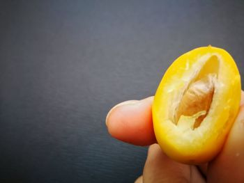 Close-up of hand holding apple