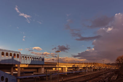 Train on railroad tracks against sky