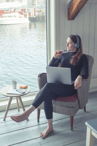 Woman sitting on chair at table