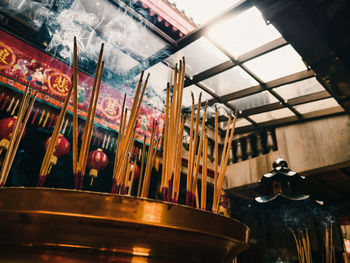 Low angle view of illuminated lanterns in restaurant