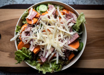 Close-up of chopped fruits in bowl on table
