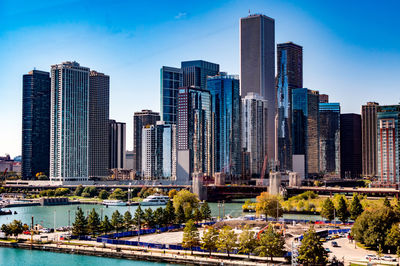 View of skyscrapers against blue sky